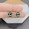 Zircon-studded letter earrings